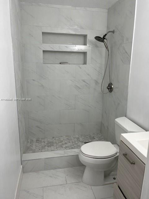 3008 Northwest 13th Street Miami, FL 33125 - Photo 10 of 32 a bathroom with a toilet and a shower