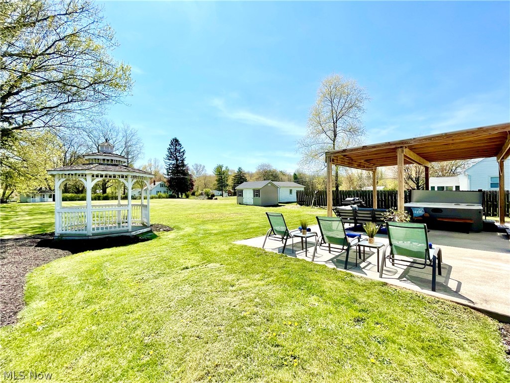 336 West Nimisila Road New Franklin, OH 44319 - Photo 18 of 19 View of the gazebo, and newly added shed (second shed far left) in this huge and flat back yard - ready for a return to summer back yard bbq & get togethers!