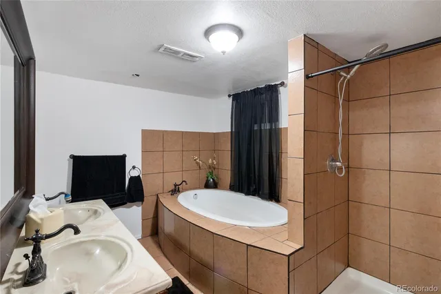a kitchen with a sink stainless steel appliances and cabinets