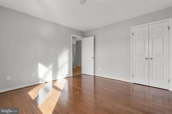 a view of an empty room and wooden floor