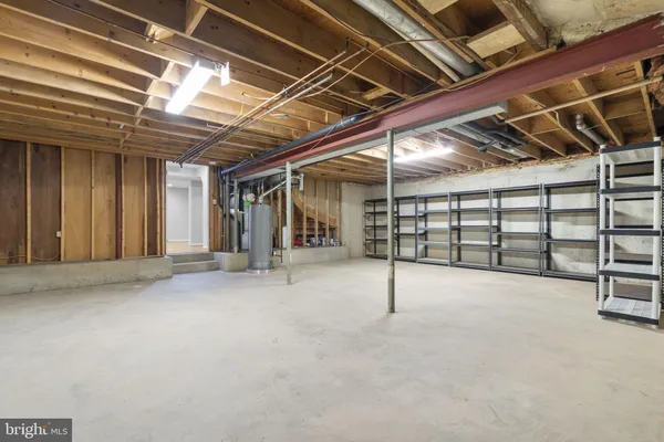a view of empty room with wooden ceiling