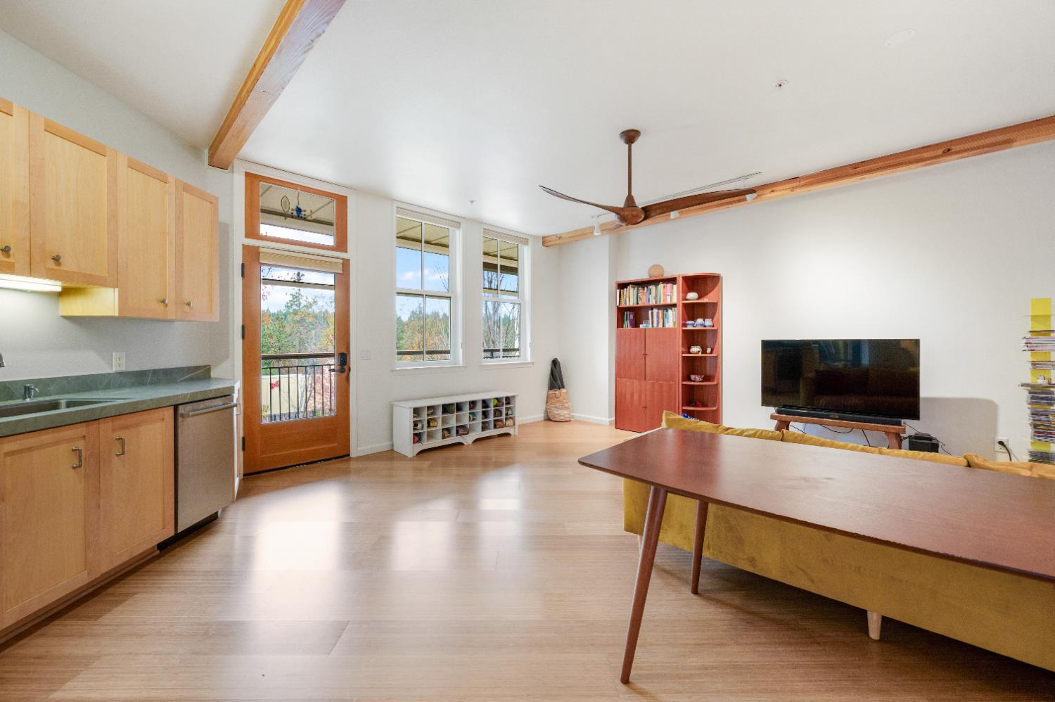 800 Freeman Lane, Unit 207 Grass Valley, CA 95949 - Photo 5 of 29 a bedroom with furniture and a flat screen tv