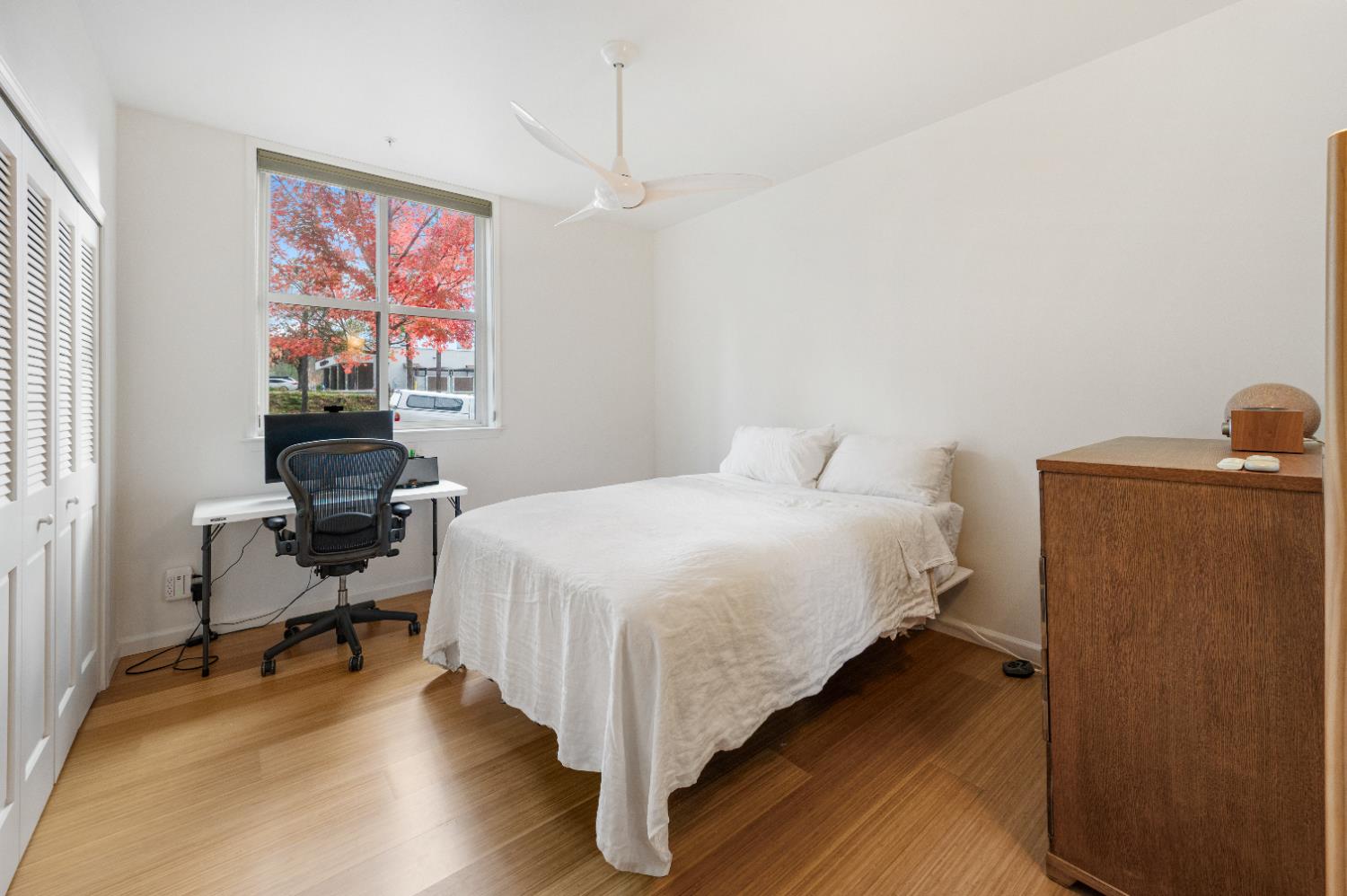 800 Freeman Lane, Unit 207 Grass Valley, CA 95949 - Photo 10 of 29 a bedroom with a bed and wooden floor