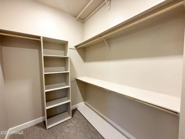 a bathroom with a double vanity sink and mirror