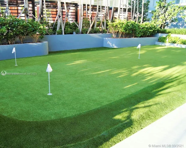 a view of a backyard with a garden and plants