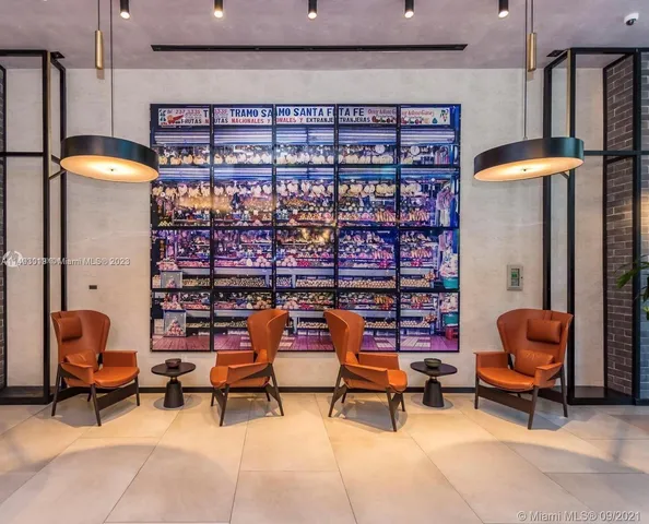 a outdoor living space with furniture and a rug