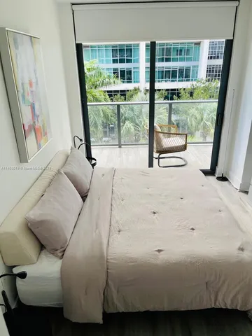 a living room with furniture and a gate