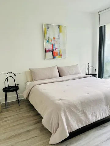 a kitchen with a stove a sink and a refrigerator