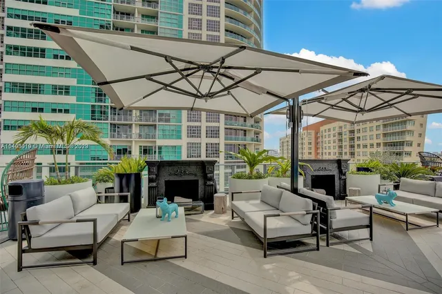 a room with lots of chairs and wooden floor