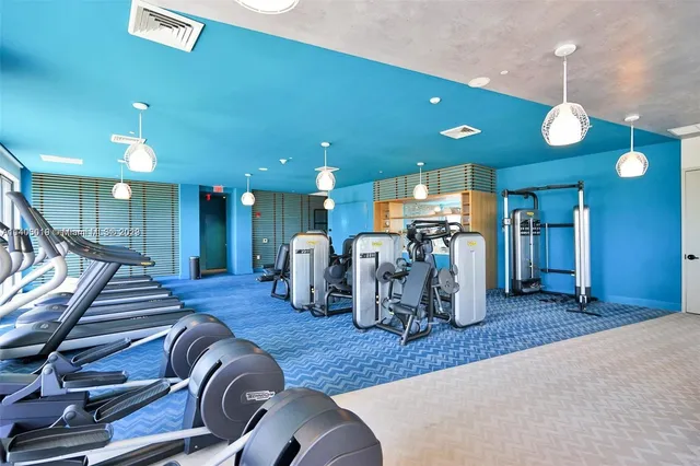 a room with furniture and gym equipment