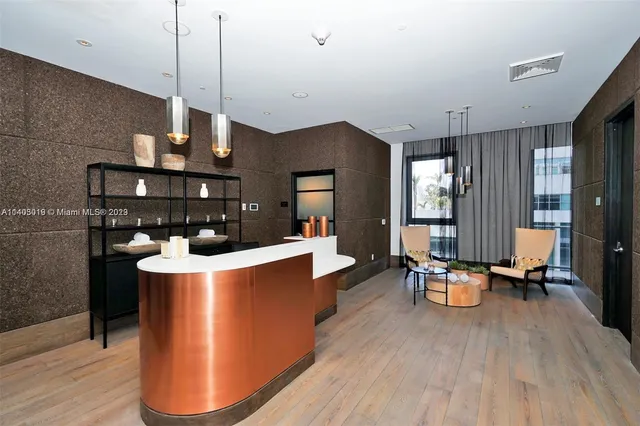 a dining room with furniture a rug and a chandelier