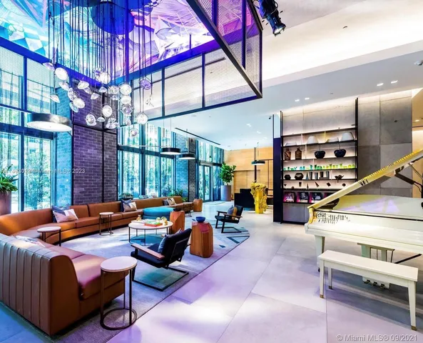 a outdoor living space with patio furniture and a large tree