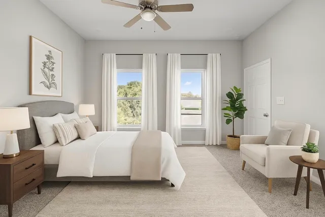 a spacious bedroom with a large bed and a couch