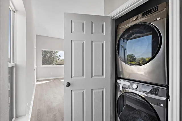 a view of a storage and utility room with washer and dryer