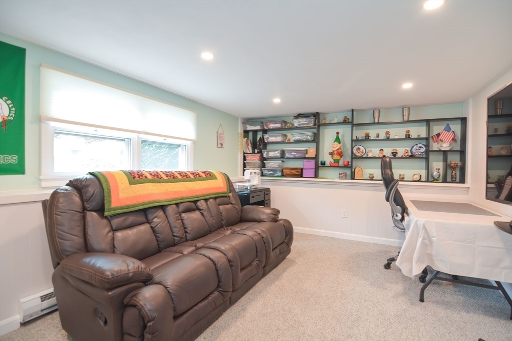 123 Capper Drive Canton, MA 02021 - Photo 18 of 32 a bedroom with a bed and a couch