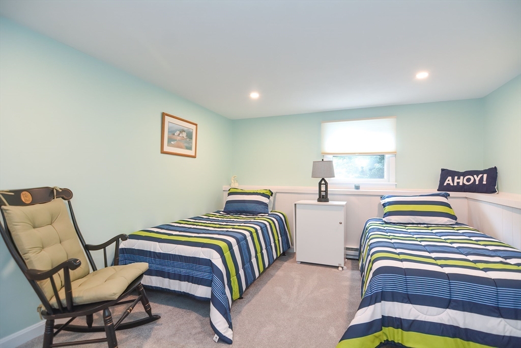 123 Capper Drive Canton, MA 02021 - Photo 20 of 32 a bedroom with two beds and a chair