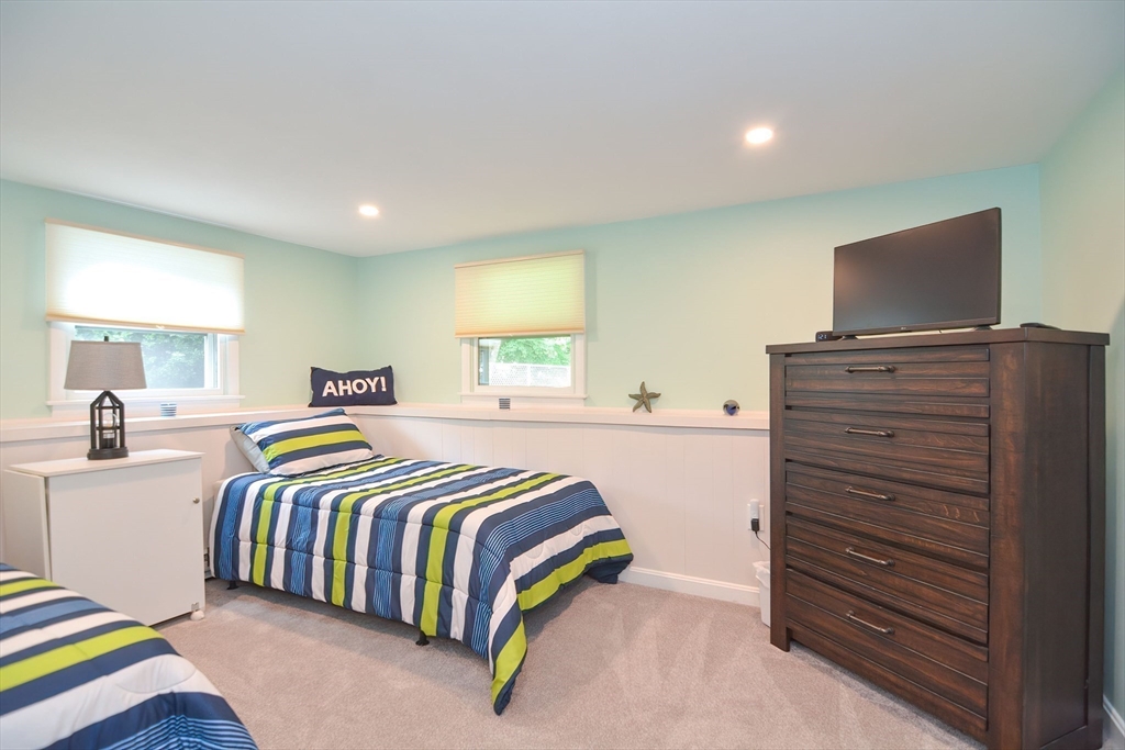 123 Capper Drive Canton, MA 02021 - Photo 22 of 32 a bedroom with a bed and flat screen tv