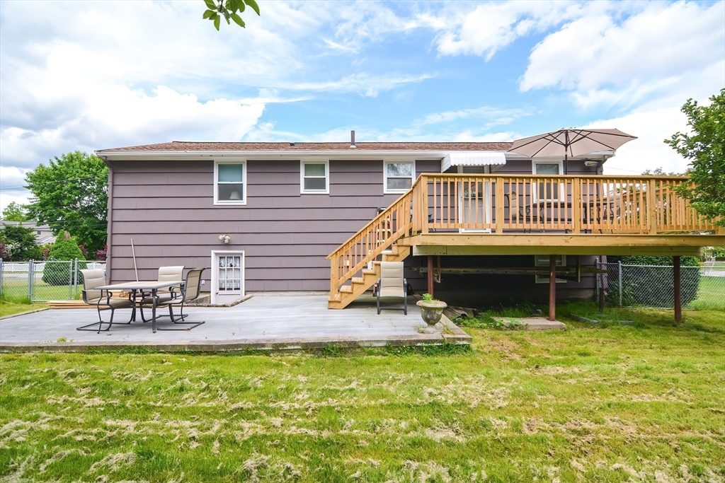 123 Capper Drive Canton, MA 02021 - Photo 26 of 32 a view of a house with backyard porch and sitting area