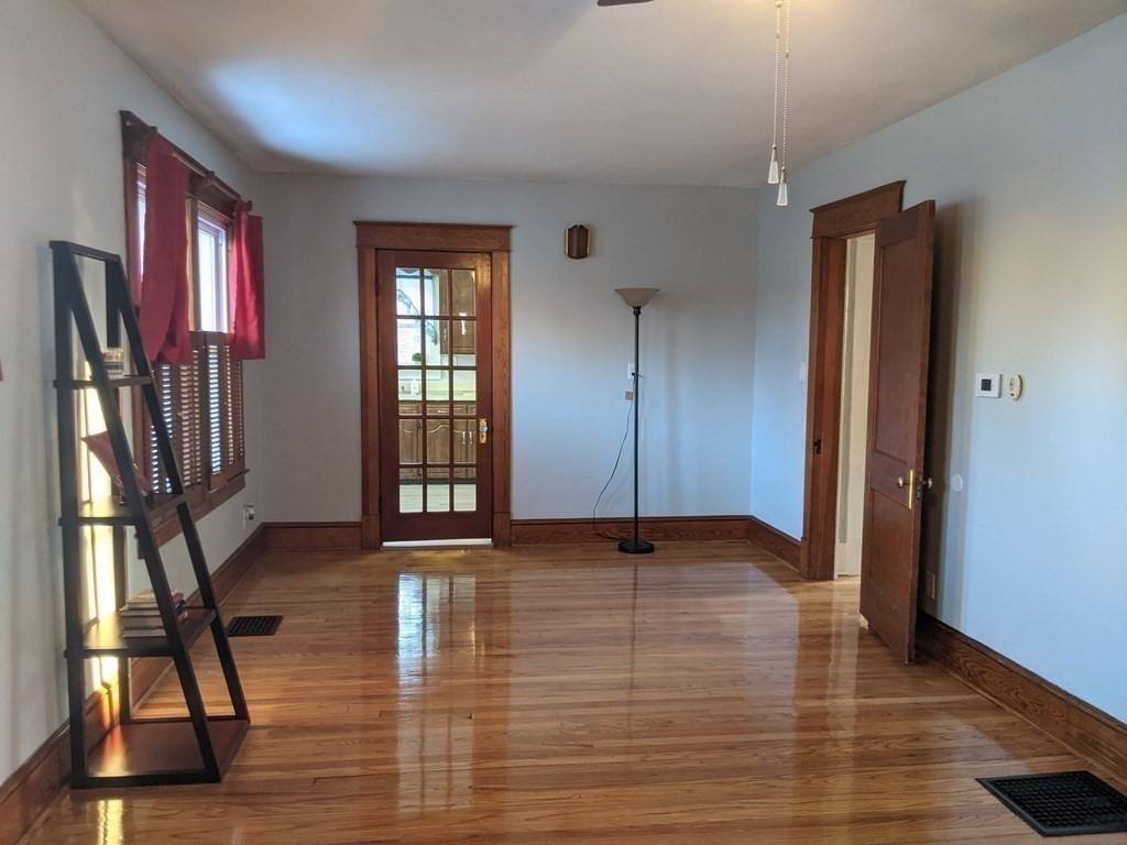 37 Montcalm Street Springfield, MA 01151 - Photo 12 of 33 a view of an empty room with window and wooden floor