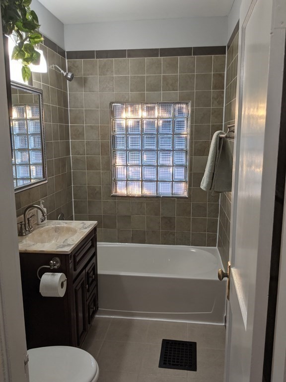 37 Montcalm Street Springfield, MA 01151 - Photo 16 of 33 a bathroom with a granite countertop sink toilet and shower
