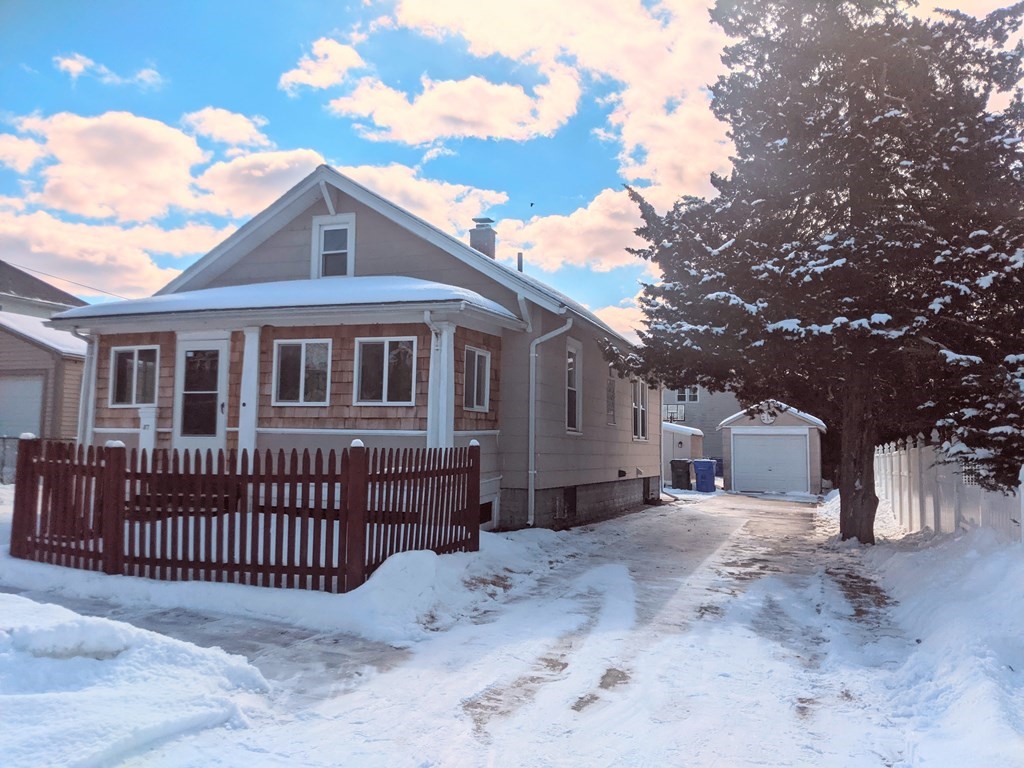 37 Montcalm Street Springfield, MA 01151 - Photo 3 of 33 a front view of a house with a wooden fence