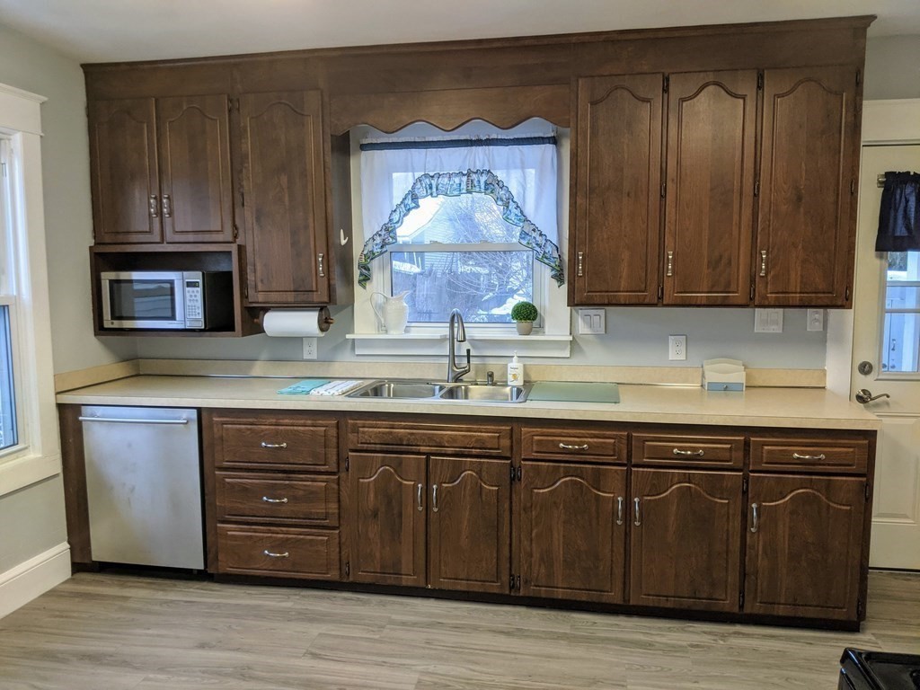 37 Montcalm Street Springfield, MA 01151 - Photo 10 of 33 a kitchen with wooden cabinets and a sink
