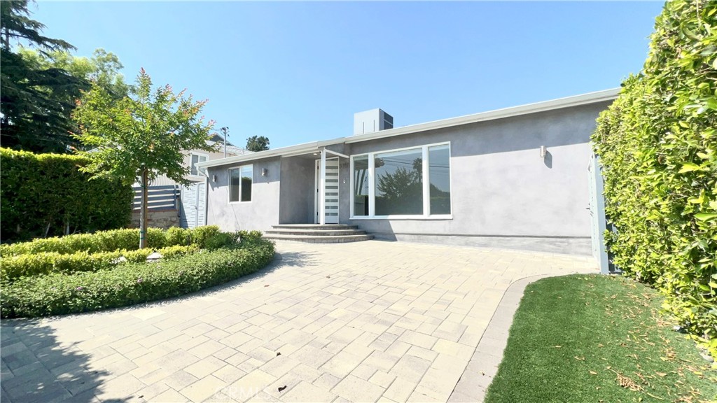 a house view with a outdoor space