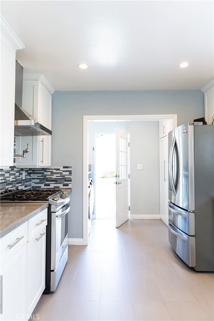 3155 Brookhill Street La Crescenta, CA 91214 - Photo 13 of 28 a kitchen with stainless steel appliances granite countertop a refrigerator and a stove