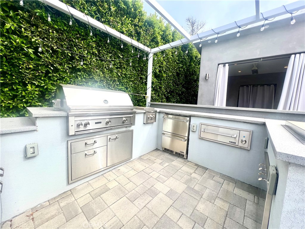3155 Brookhill Street La Crescenta, CA 91214 - Photo 22 of 28 a view of a kitchen with a stove top oven and cabinets