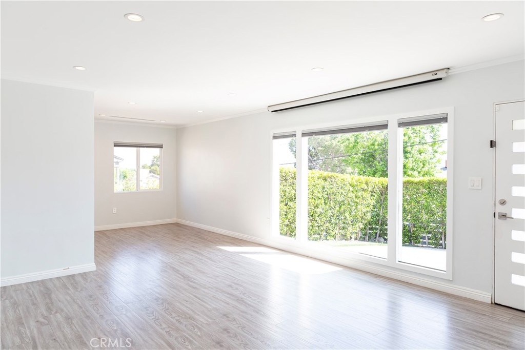 3155 Brookhill Street La Crescenta, CA 91214 - Photo 3 of 28 an empty room with wooden floor and windows