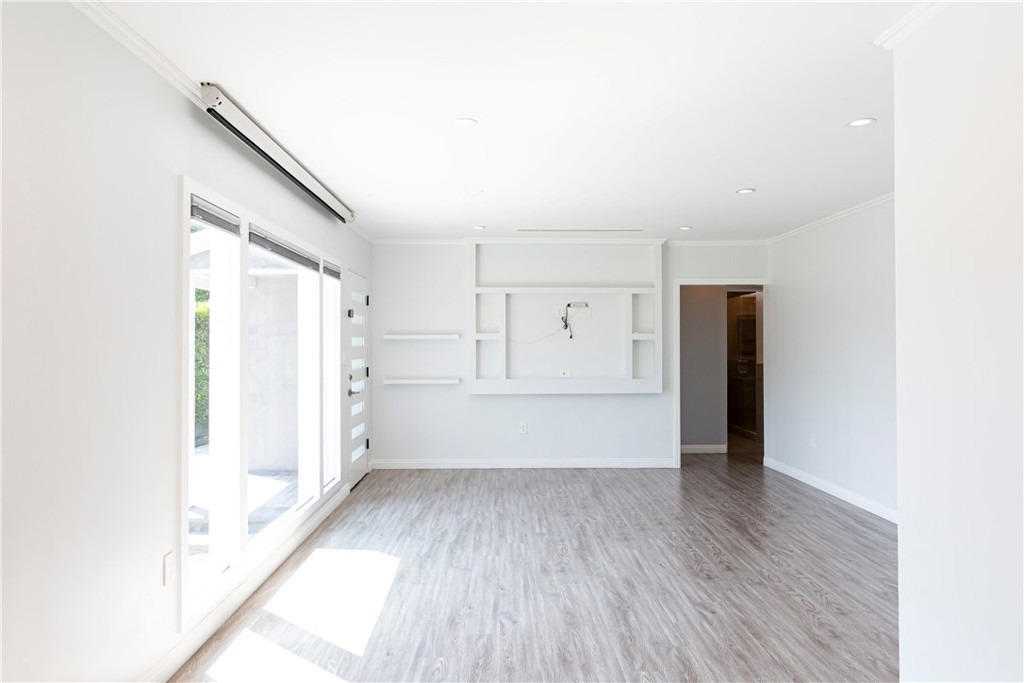 3155 Brookhill Street La Crescenta, CA 91214 - Photo 5 of 28 a view of empty room with wooden floor and window