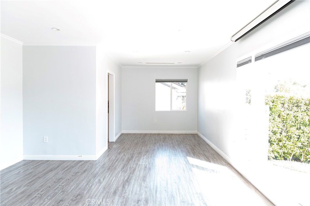 3155 Brookhill Street La Crescenta, CA 91214 - Photo 6 of 28 an empty room with wooden floor and windows