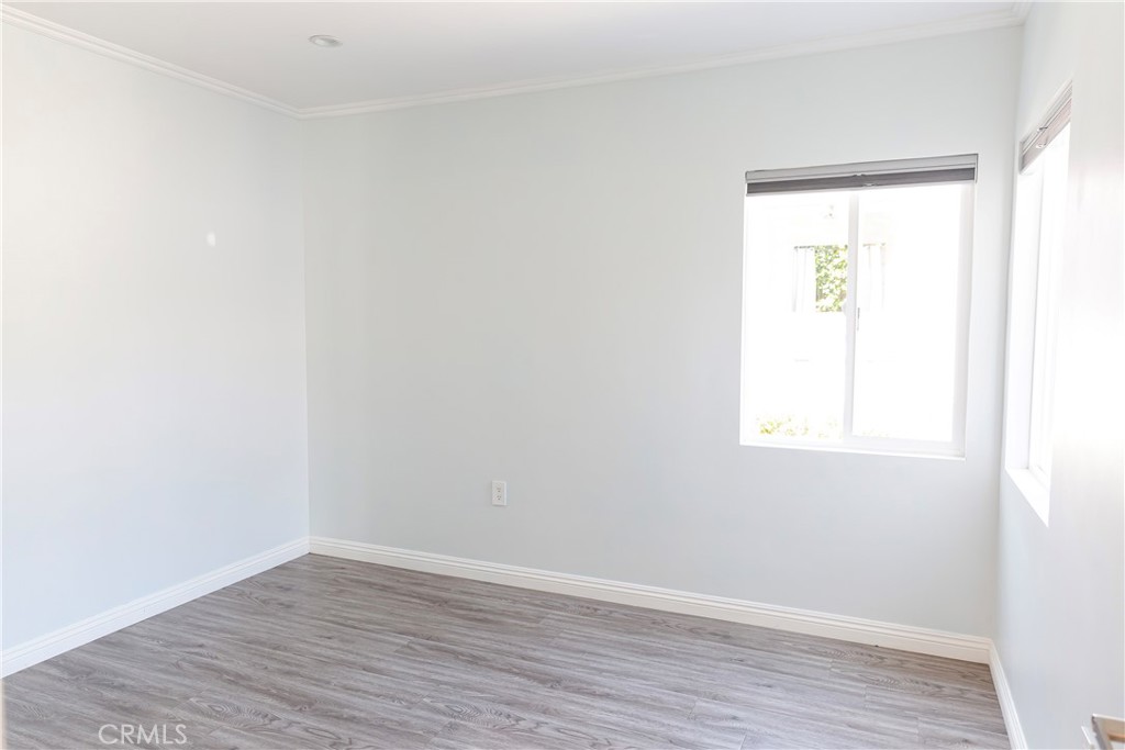 3155 Brookhill Street La Crescenta, CA 91214 - Photo 9 of 28 an empty room with wooden floor and a window