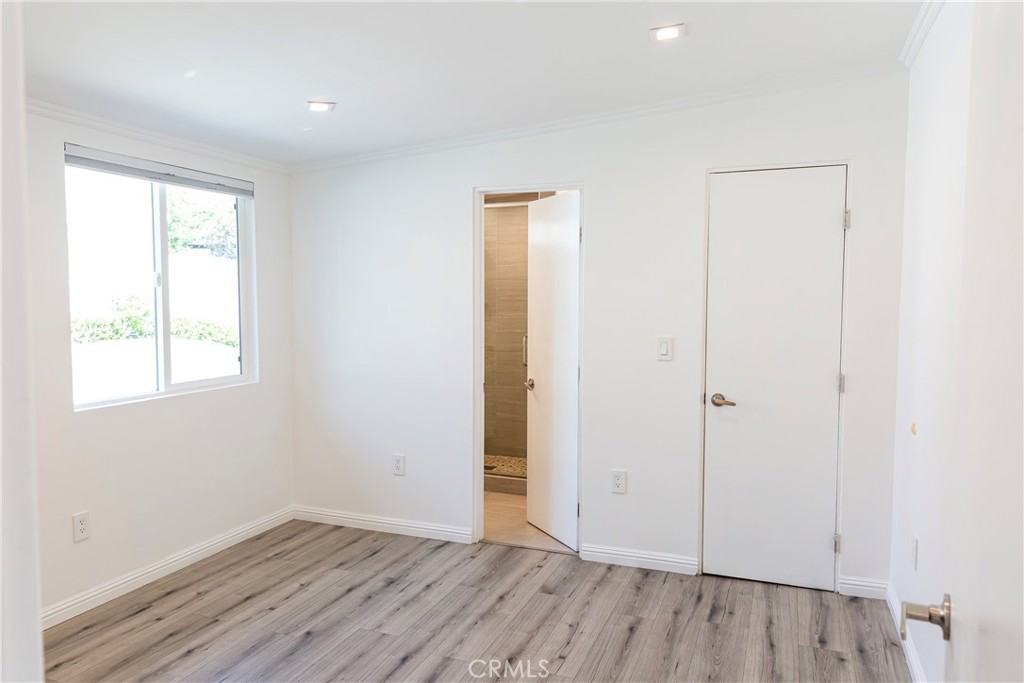 3155 Brookhill Street La Crescenta, CA 91214 - Photo 10 of 28 an empty room with wooden floor and windows