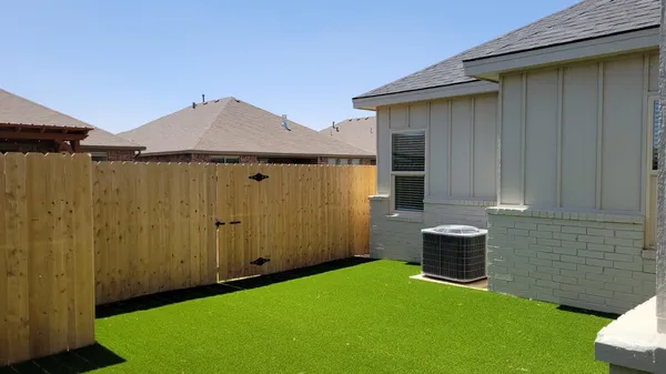 a backyard of a house with seating space