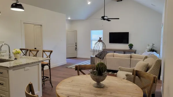 a living room with furniture and a flat screen tv