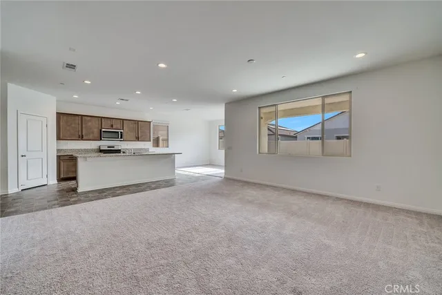 a view of a kitchen with a sink cabinets and a window