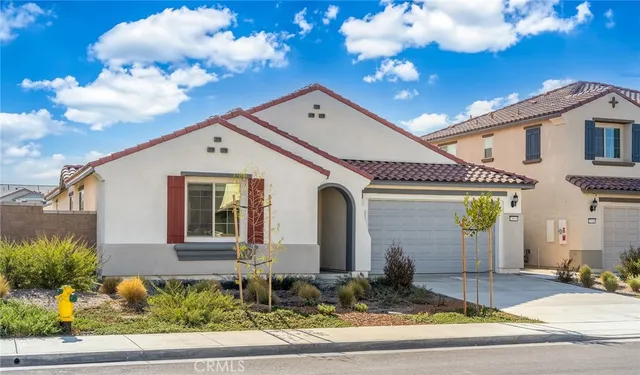 a front view of a house with garage