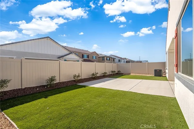 a view of a backyard of the house