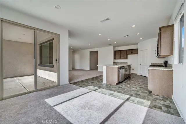 a kitchen with a sink and a stove top oven