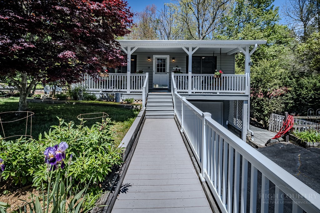 38 Rocky Meadows Road Newland, NC 28657 - Photo 2 of 50 a front view of a house with a porch