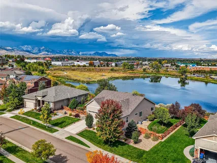 a view of a lake with a houses in the background