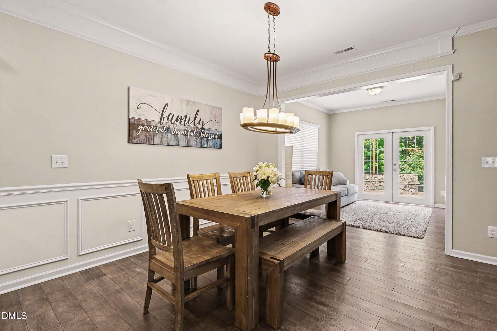 4366 Auburn Hills Drive Raleigh, NC 27616 - Photo 10 of 40 a view of a dining room with furniture window and wooden floor