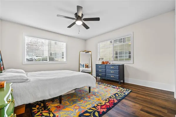 a bed room with a bed and a window