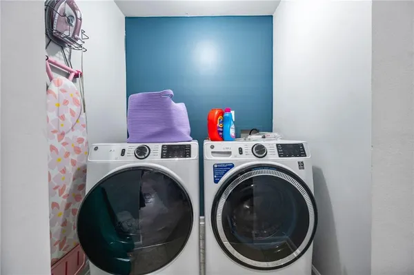 a utility room with dryer and washer