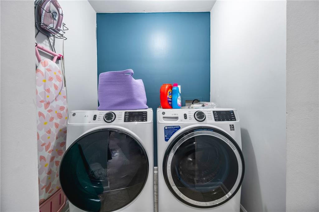 1468 Briarwood Road Northeast, Unit 401 Brookhaven, GA 30319 - Photo 20 of 26 a utility room with dryer and washer