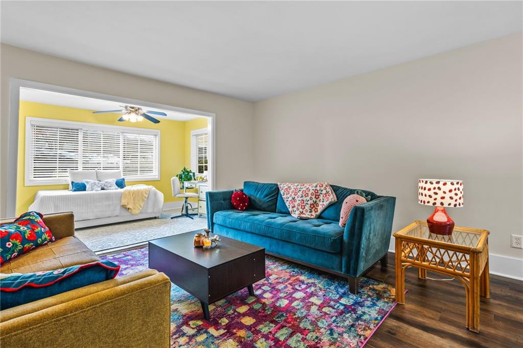 1468 Briarwood Road Northeast, Unit 401 Brookhaven, GA 30319 - Photo 2 of 26 a living room with furniture and a floor to ceiling window