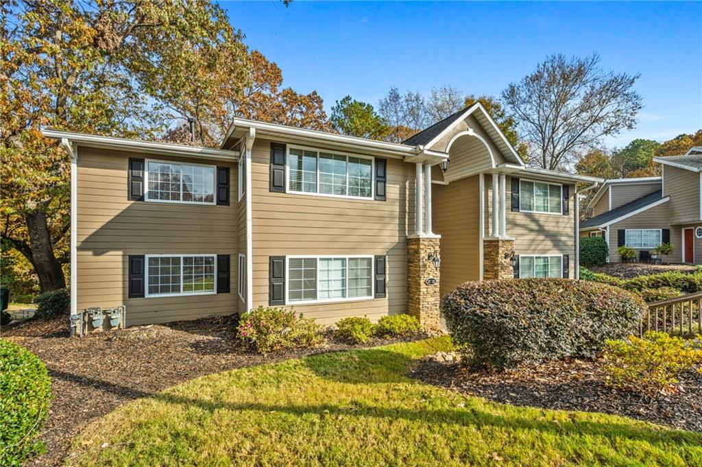 1468 Briarwood Road Northeast, Unit 401 Brookhaven, GA 30319 - Photo 23 of 26 a view of a yard in front of a house
