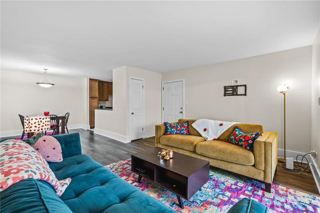 1468 Briarwood Road Northeast, Unit 401 Brookhaven, GA 30319 - Photo 5 of 26 a living room with furniture and a couch