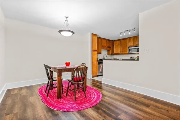 a view of a dining room with furniture and wooden floor